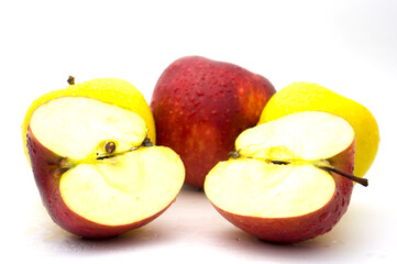Apples on a white background with water droplets.