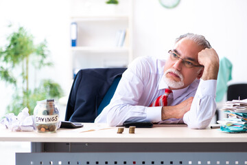 Old male accountant in budget planning concept