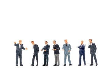 Miniature people, Businessman standing on white background
