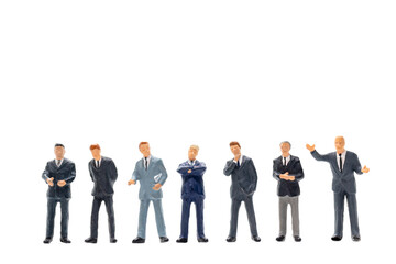 Miniature people, Businessman standing on white background