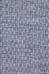 Close-up of woven surface. Pale blue tinted fabric background. Top view from above. Light braided backdrop for sewing or handicraft. Vertical wallpaper