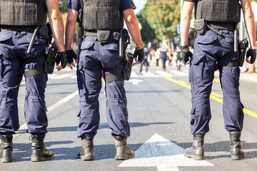 Police officers on duty during street protest - obrazy, fototapety, plakaty