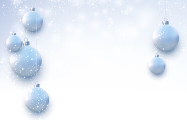 Matt light blue christmas balls hanging on threads.