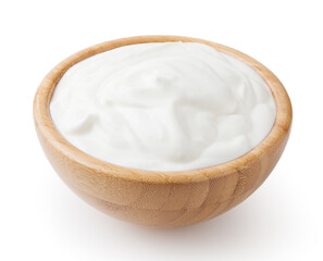 Sour cream in wooden bowl isolated on white background with clipping path