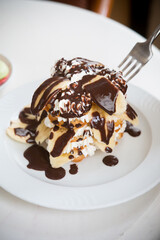 Sweet pancakes with chocolate and bananas