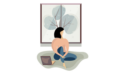 Woman sitting on the floor and watching laptop