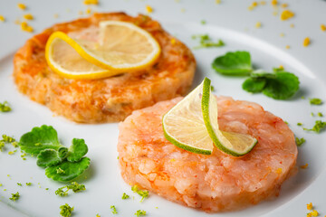 shrimp burger with lemon on white plate