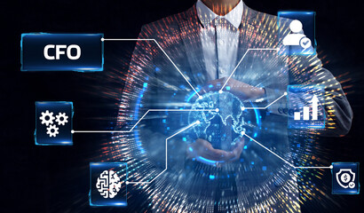 Business, Technology, Internet and network concept. Young businessman working on a virtual screen of the future and sees the inscription: CFO