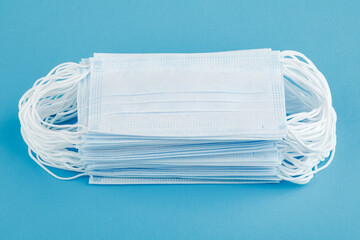 Medical mask, medical protective mask isolated on a blue background. Health care coronavirus...