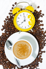 espresso cup and alarm clock, conceptual photography, closeup