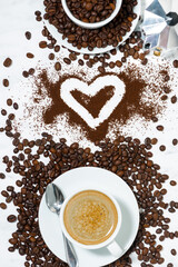espresso cup, heart and coffee beans conceptual photography