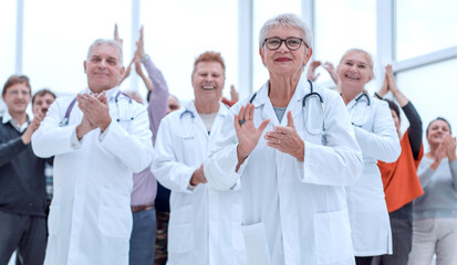 doctors and patients clap their hands. applaud and enjoy success