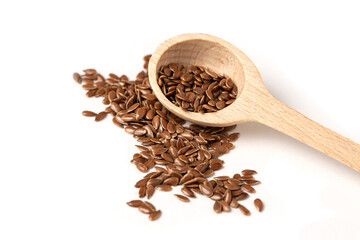 Superfood and diet concept with raw flax seeds in wooden spoon on white background, copy space