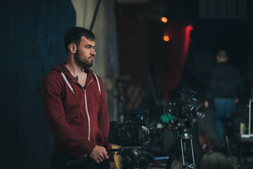 Director of photography with a camera in his hands on the set.