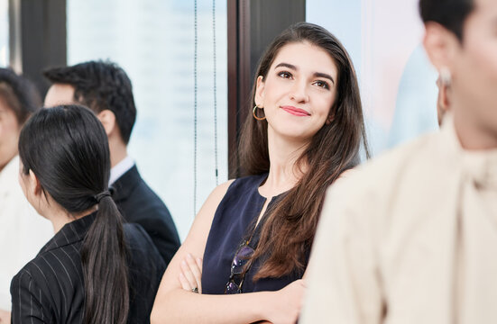 A businesswoman is looking happy with smile and being optimistic with her future plan during her business meeting.