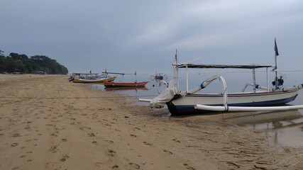 boats docked at the shores in the morning