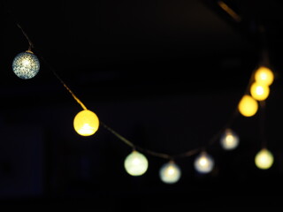 Gold Christmas balls on a black background