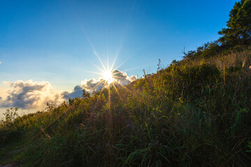 Beautiful sunset with sunstar view point from Khao Luang Sukhothai, Ramkhamhaeng National Park , Sukhothai Thailand.