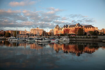 View of Victoria Harbor with sailing boats and yachts under Sunset in Vancouver island, BC, Canada
