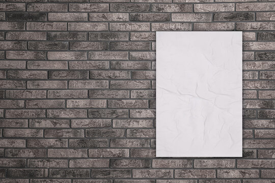 Fototapeta Blank creased poster on grey brick wall. Mockup for design