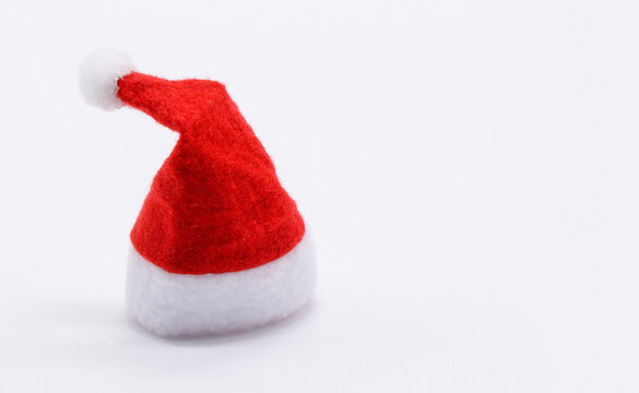 Santa's red hat close-up on a white background. Free space for text.