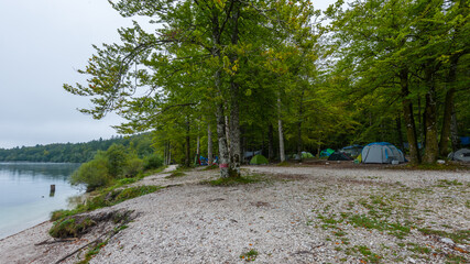 Campground at the beautiful Lake Bohinj in the Triglav National Park in Slovenia on misty morning...