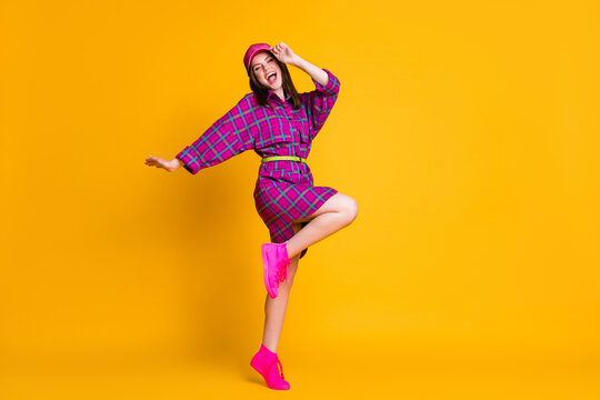 Full length photo of nice young person dancing arm touch headwear isolayed on bright yellow color background