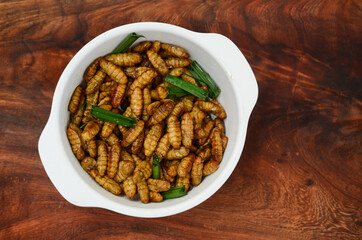 fried silkworms and  pandan leaf, Thailand street food