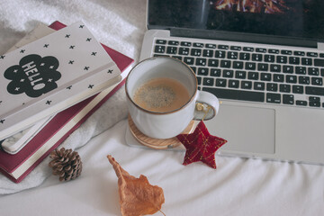 Panoramic coffee time before working with a laptop and notebooks from home. Winter day in 2020. 