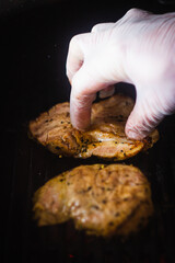 hand holding a piece of meat