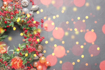 Obraz na płótnie Canvas Beautiful Christmas wreath with blurred lights on dark background