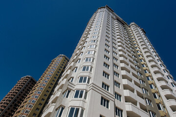 External insulation for the walls of the house. Construction site. Production of apartments, social...