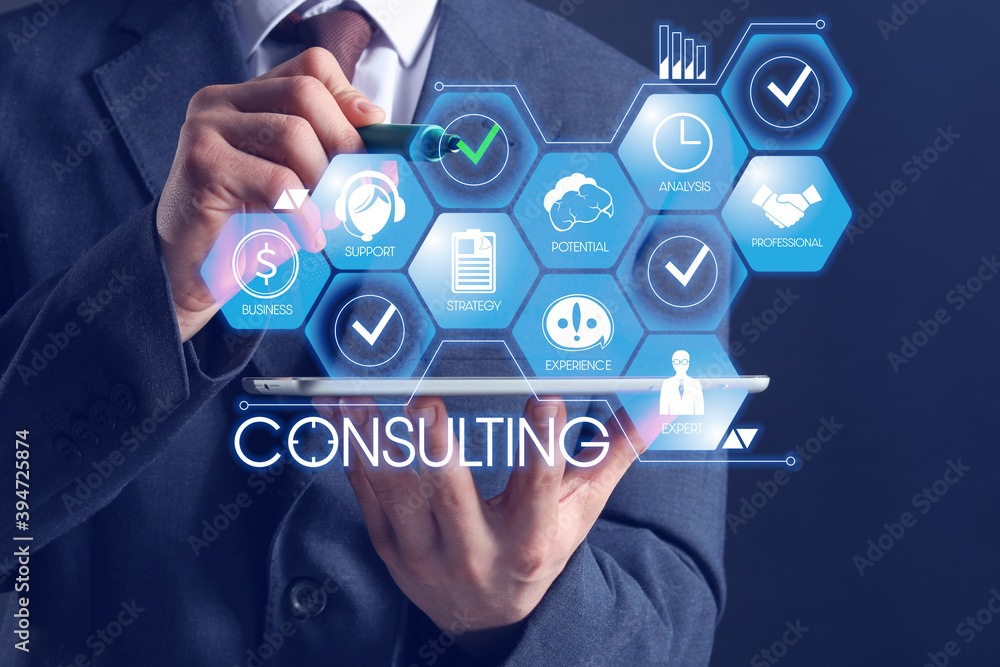 Poster business consultant with tablet computer using virtual screen on dark background