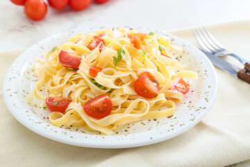 Plate with tasty pasta primavera on table