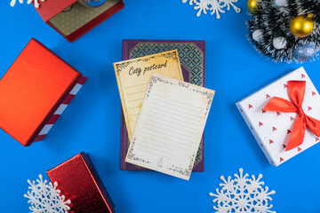 Christmas composition on a blue background and with New Year's decorations, greeting cards with copy space