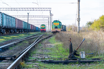Two green locomotives on flights.