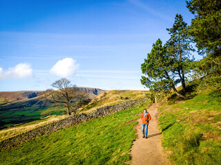 A tourist in Peak District, an upland area in England at the southern end of the Pennines