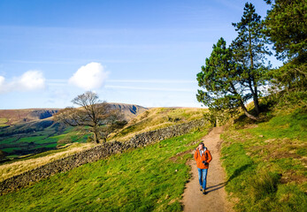 A tourist in Peak District, an upland area in England at the southern end of the Pennines