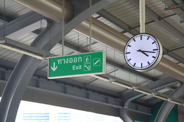 Clock and exit sign on the train station