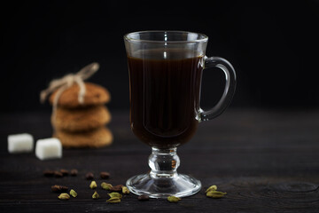 coffee with cardamom in a clear glass on the table