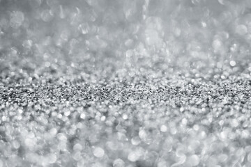 Abstract silver glitter sparkle texture with bokeh background