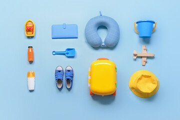 Flat lay composition with child beach accessories on color background. Travel concept
