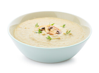Bowl of tasty mushroom cream soup on white background