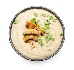 Bowl of tasty mushroom cream soup on white background