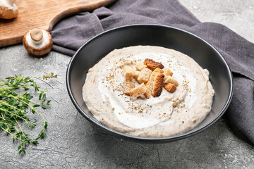 Bowl of tasty cream soup on  dark background