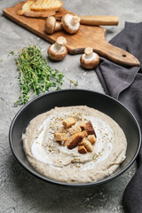 Bowl of tasty cream soup on  dark background