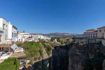 Obraz premium View into the gorge El Tajo in Ronda, one of the famous white towns of Andalusia, Spain.