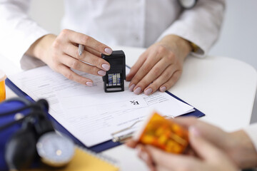 Doctor writes prescription for pills to patient. Prescription drugs concept