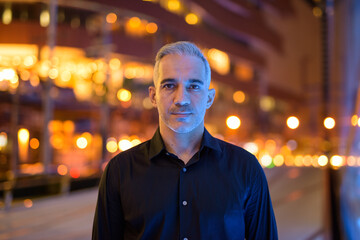 Portrait of attractive man at night on the streets