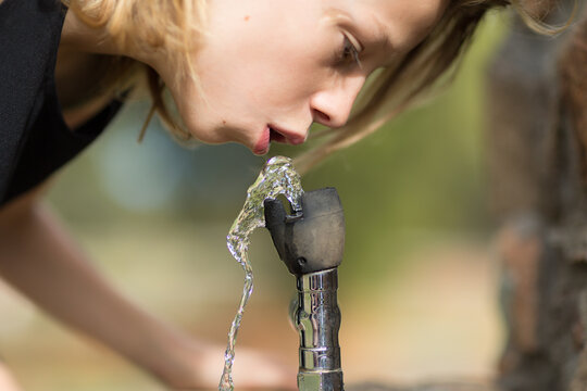 Drinking water from bubbler fountain